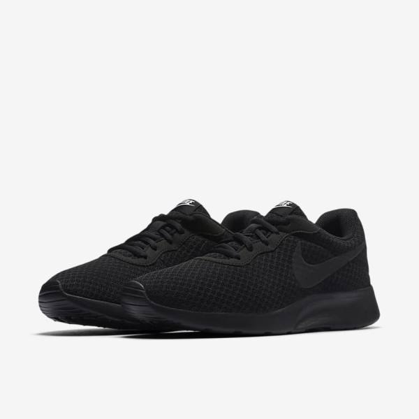 Women's Nike Tanjun Sneakers Black / White | NK729JQV